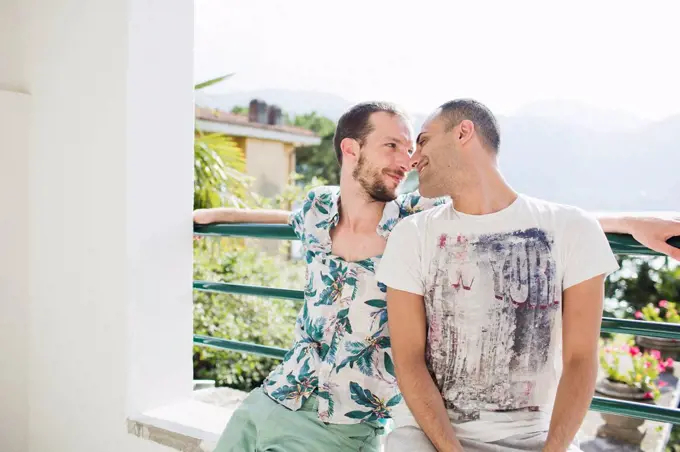 Loving gay couple outdoors