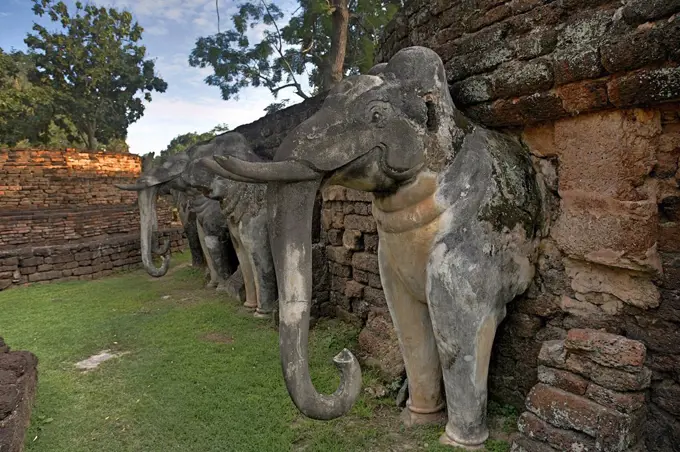 Thailand, Kamphaeng Phet, Ruins of Chakangrao, Wall with elephant statues, UNESCO World Heritage