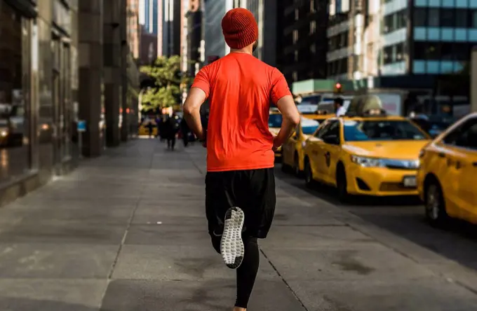 USA, New York City, man running in Manhattan