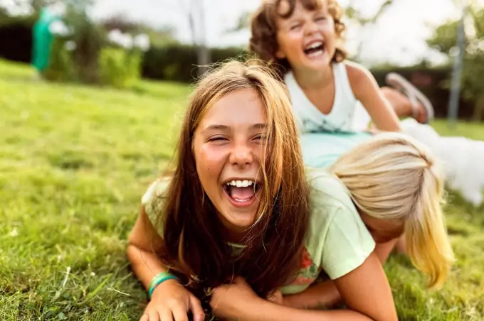 Girls having fun together on a meadow