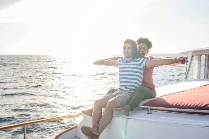 Happy young couple on a boat trip
