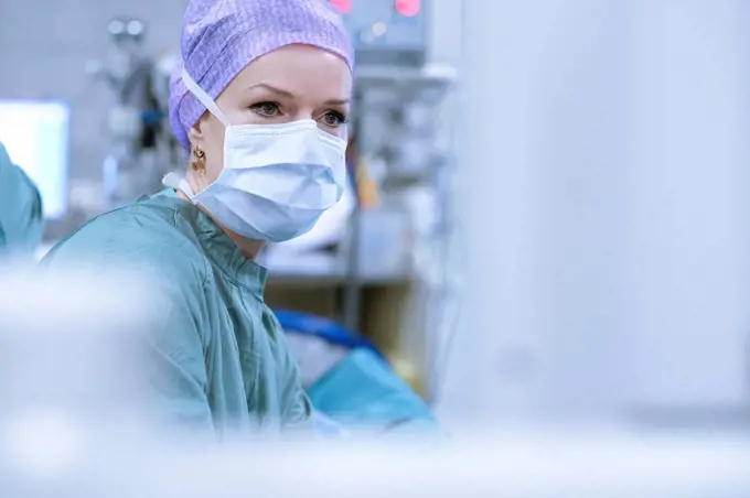 Surgeon in scrubs during an operation
