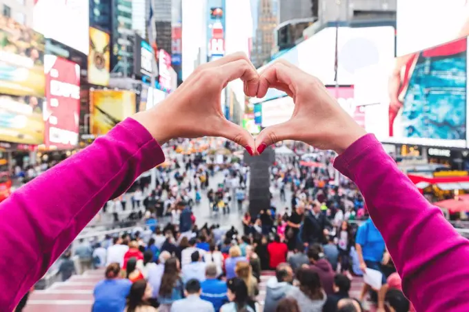 USA, New York, heart-shaped hands on Times Square