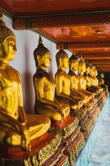 Thailand, Bangkok, row of Buddha statues at Grand Palace