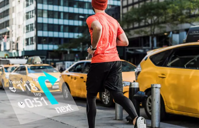 USA, New York City, man running in the city with data around him