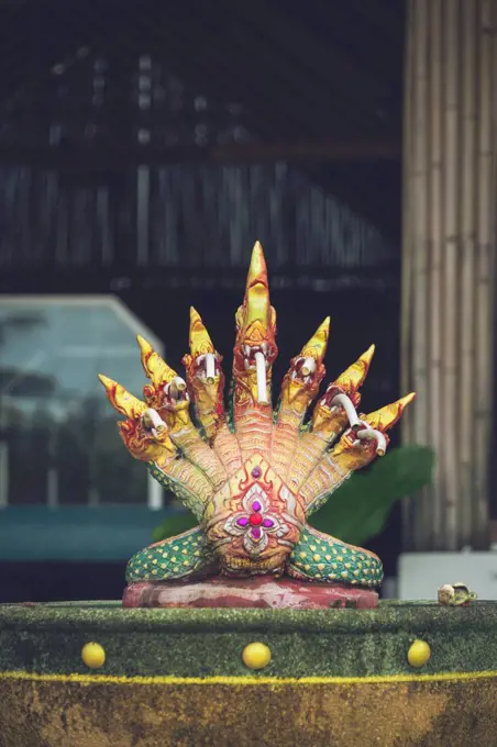 Thailand, Khao Lak, Buddhist snake sculpture on a fountain