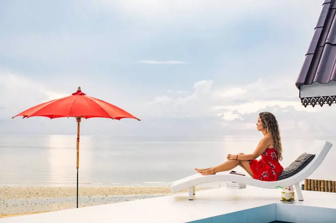 Thailand, Koh Phangan, woman relaxing near the beach