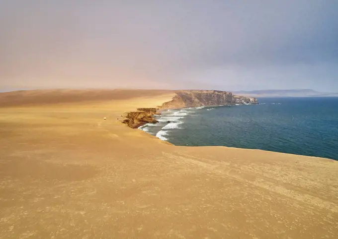 Peru, Paracas, camper at cliff coast in National Park Paracas