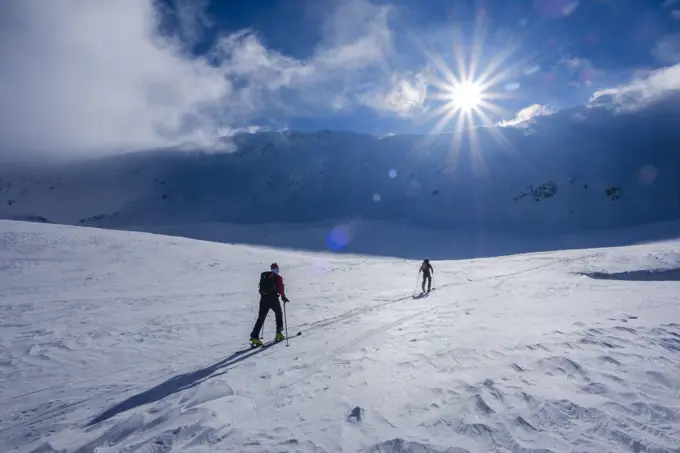 Two men doing a ski tour in Faragas mountains, Southern Carpathians, Romania