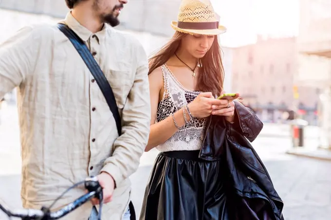 Young woman using smartphone in the city
