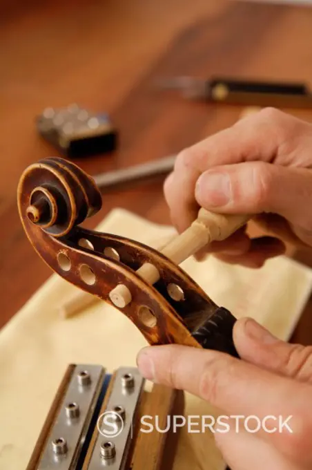 Germany, Upper Bavaria, Schaeftlarn, Violin maker making violin, close up
