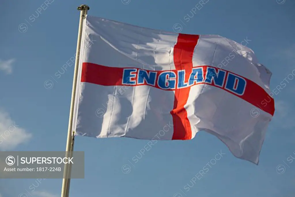 England flag flying against blue sky