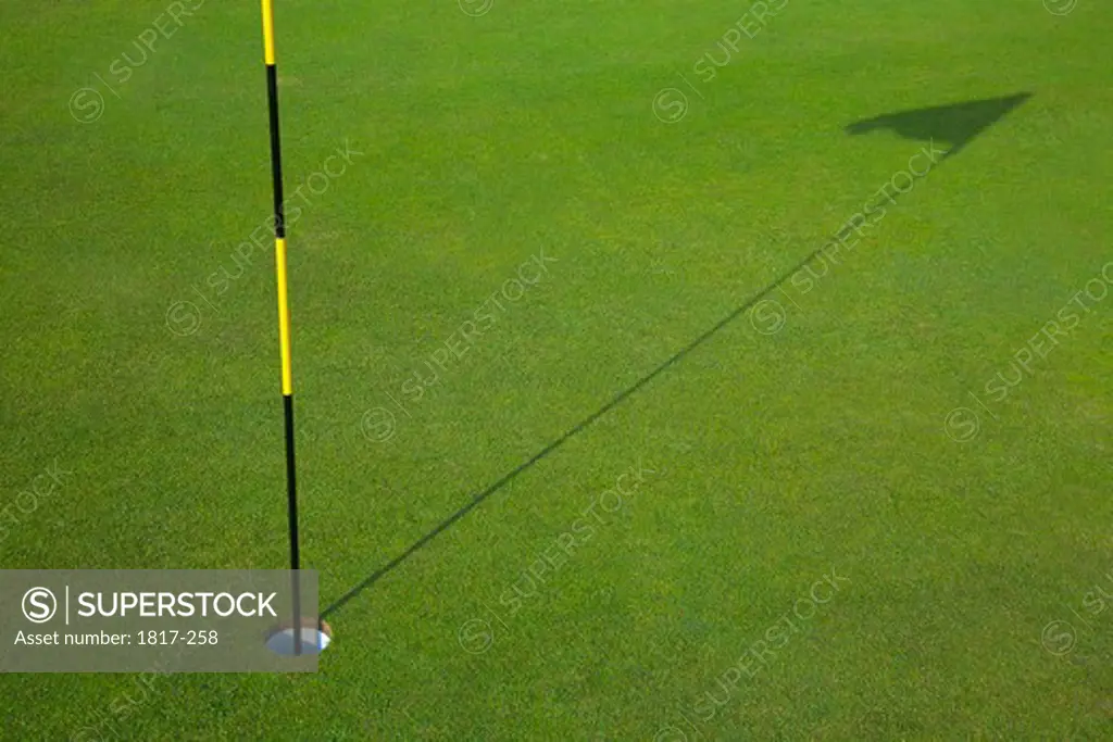Flagstick on the golfing green