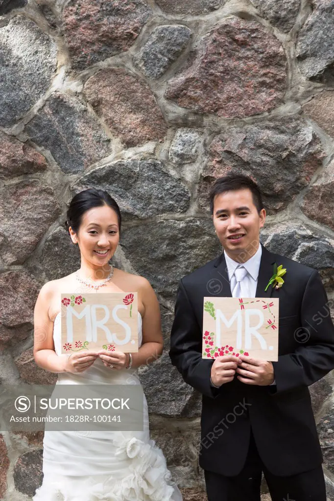 Portrait of Married Couple with Mr and Mrs Signs. 09/29/2012
