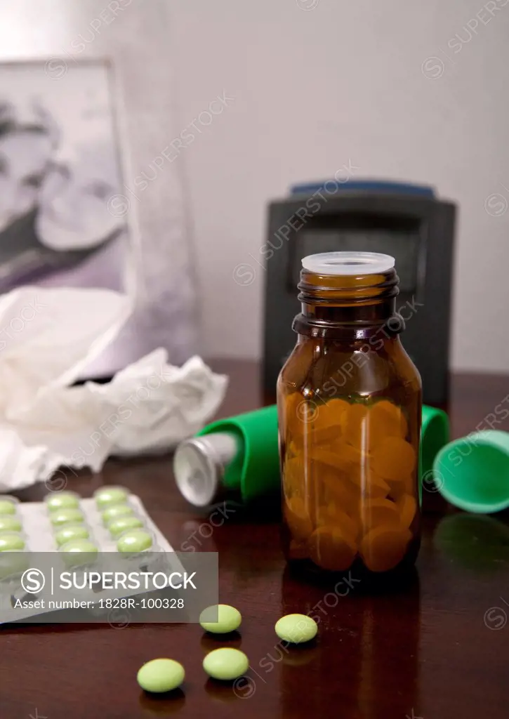 Variety of medications on bedside table, studio shot. 07/06/2011