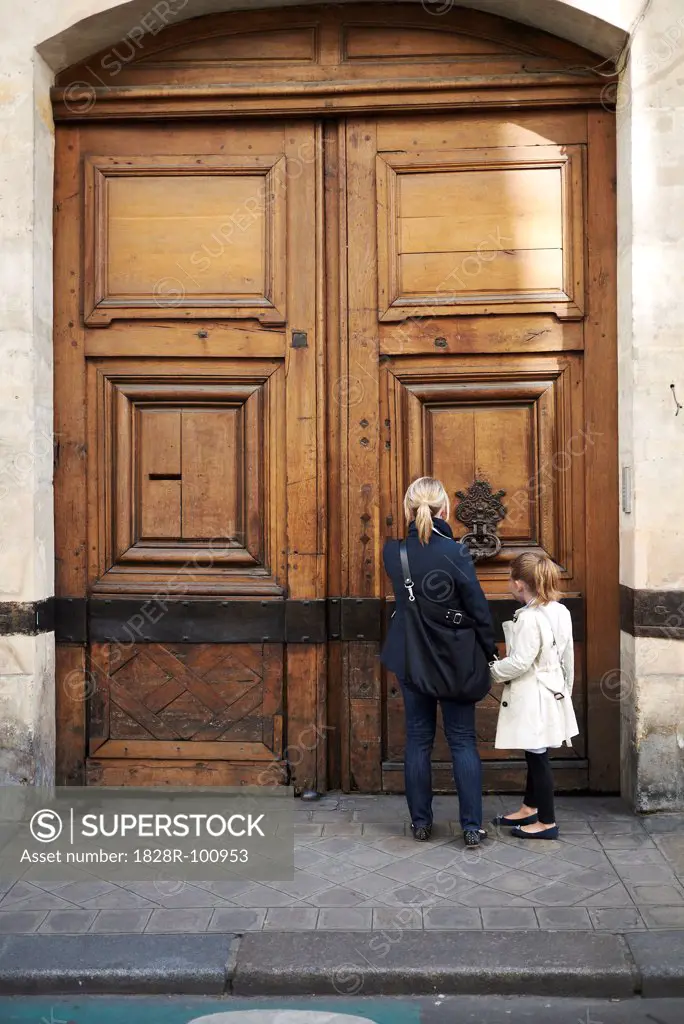 Mother and Daughter at Doorway, Paris, France. 05/13/2012
