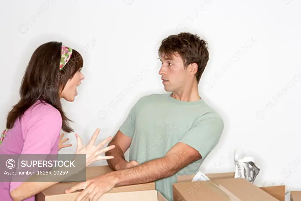 Couple Arguing amongst Boxes   