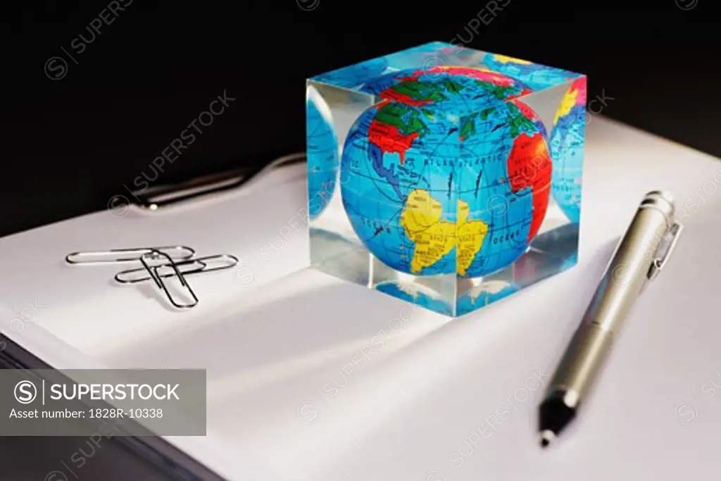 Paperweight, Pen and Paperclips on Clipboard   