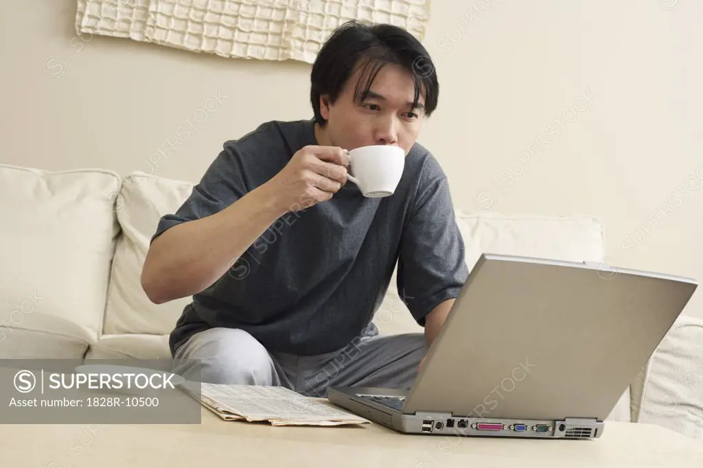 Man Working on Laptop Computer   