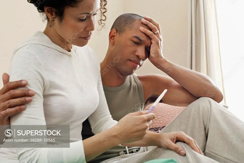 Couple Looking at Pregnancy Test   