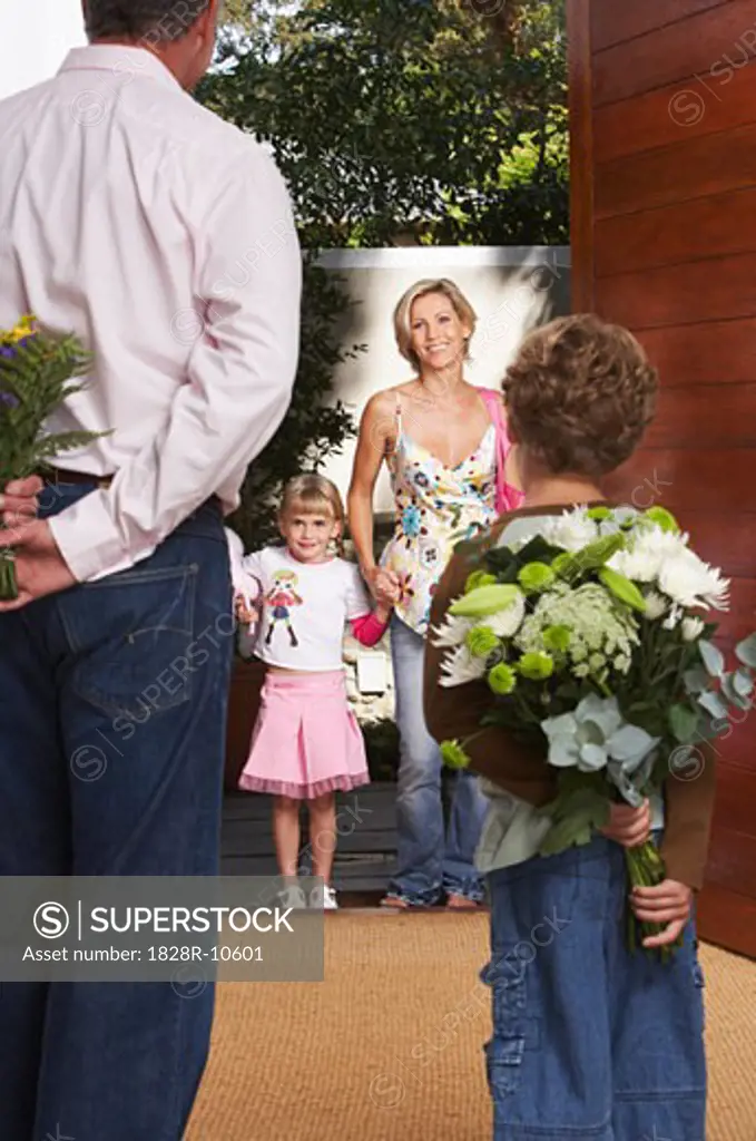 Father and Son with Flowers for Mother and Daughter   