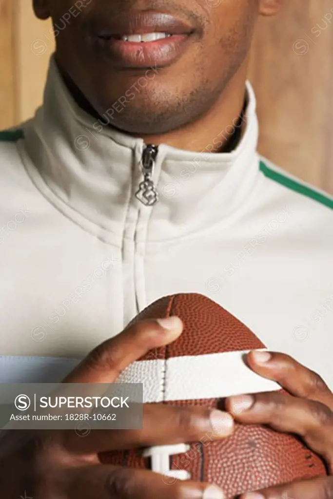 Close-Up of Man holding Football   