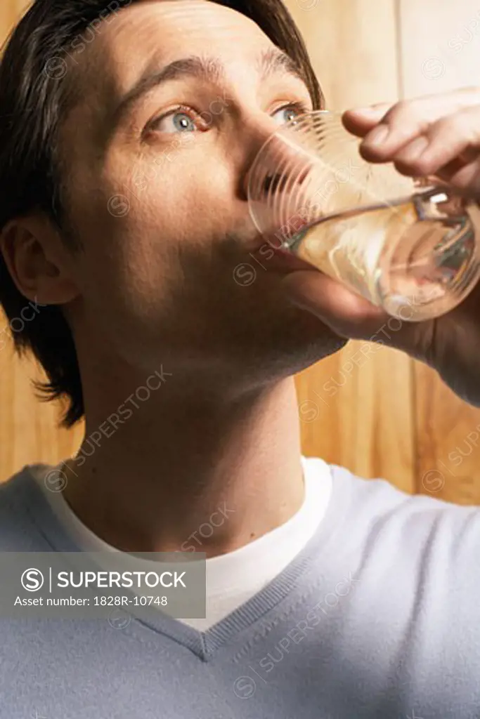 Man Drinking Glass of Water   