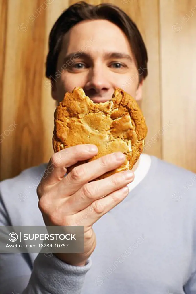 Man Holding Cookie   