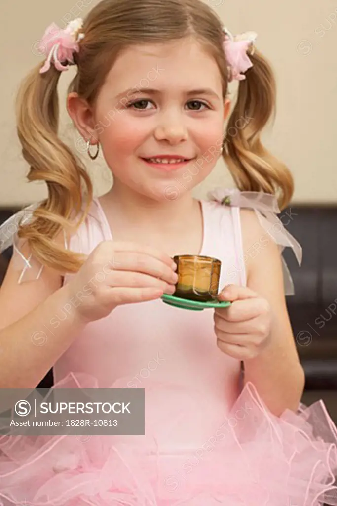 Girl Playing Tea Party   