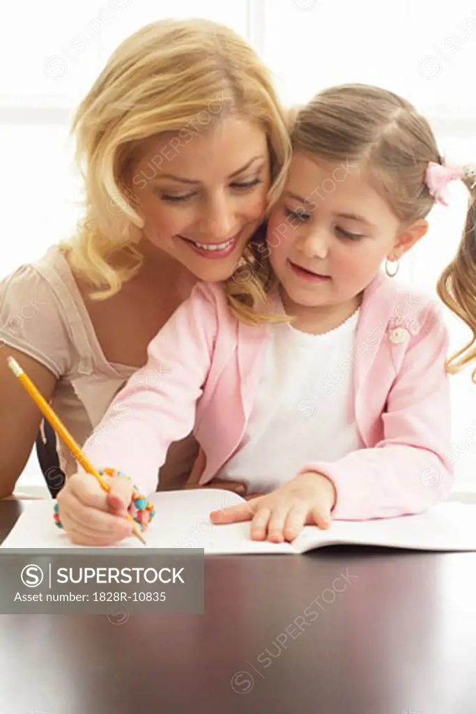 Mother Helping Daughter with Homework   
