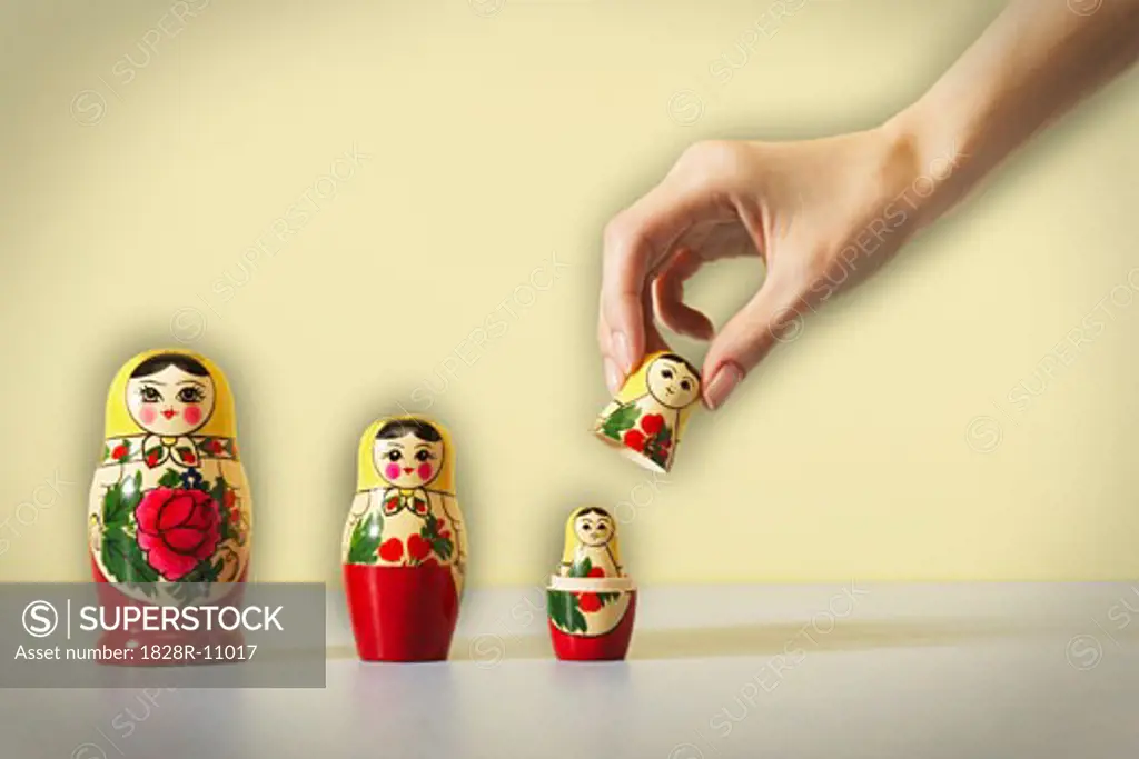 Hands Holding Matryoshka Nesting Doll   
