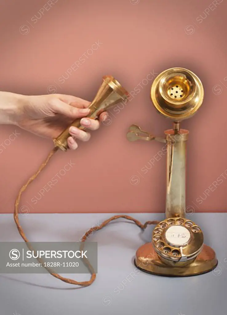 Hand on Telephone Receiver   
