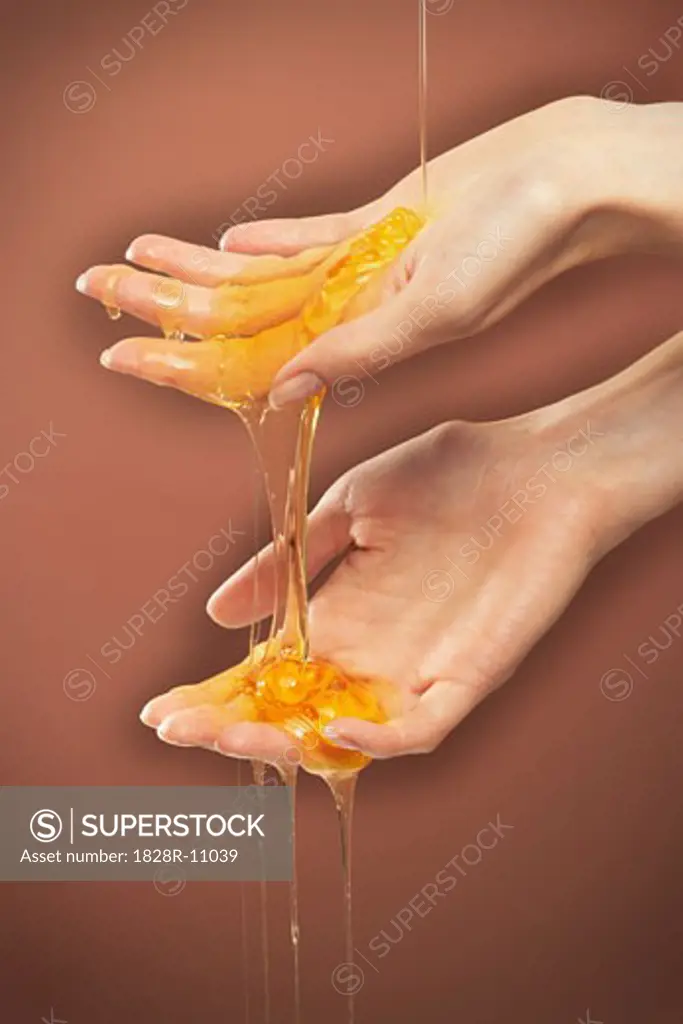 Person's Hands with Honey   