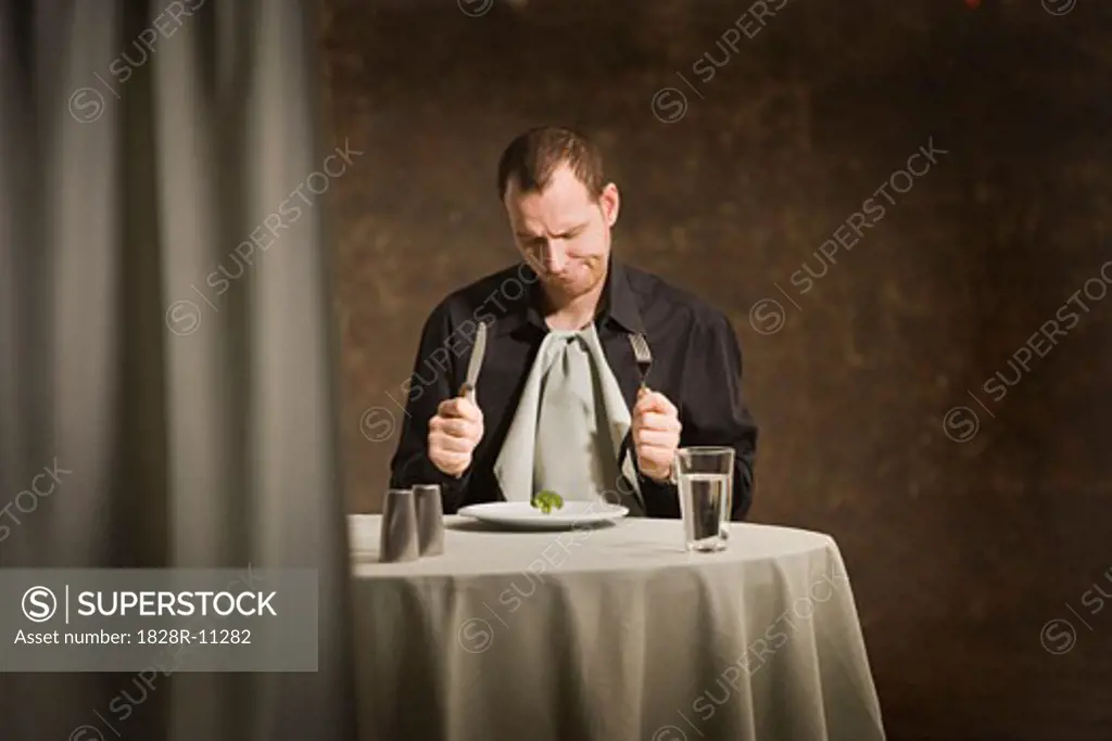 Man Sitting at Table   