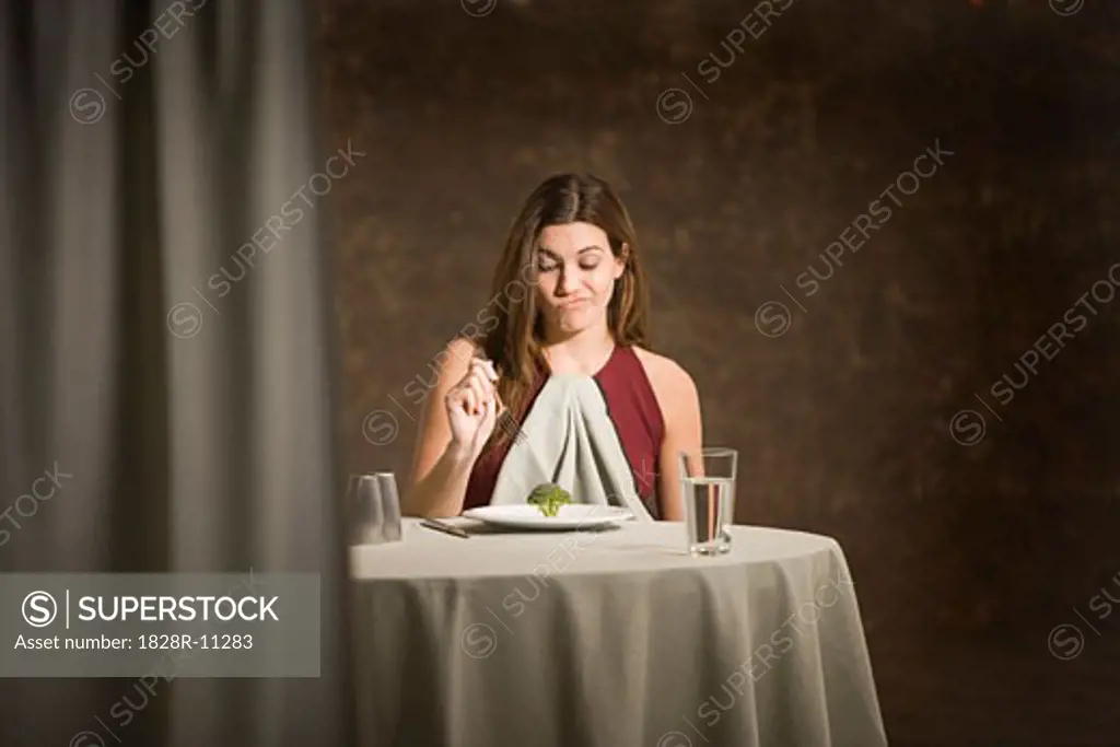 Woman Sitting at Table   