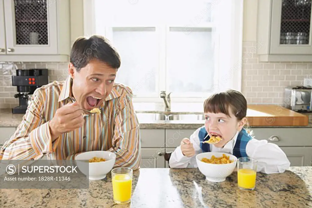 Father and Daughter Having Breakfast   