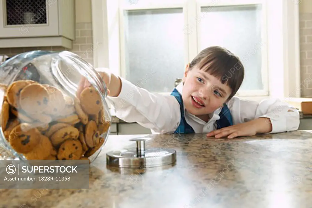 Girl Taking Cookie from Jar   