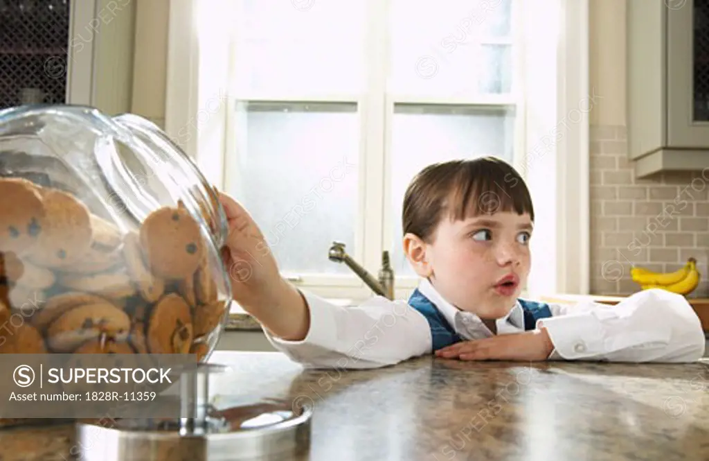 Girl Taking Cookie from Jar   