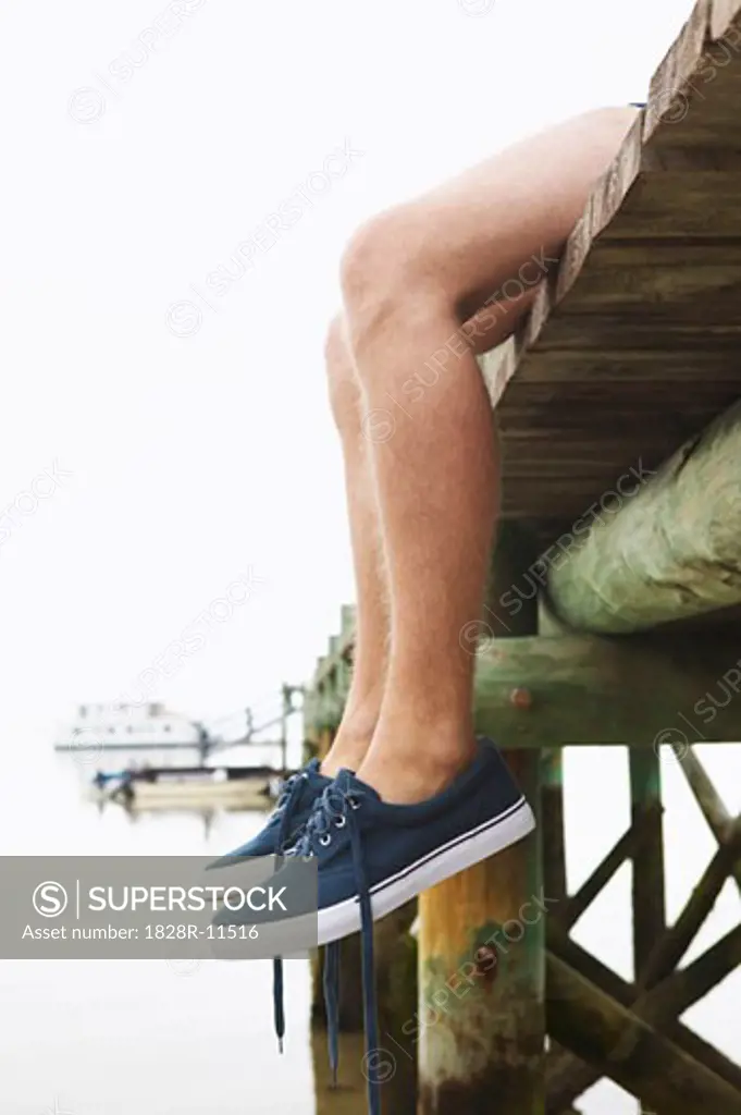 Man Sitting on Dock   