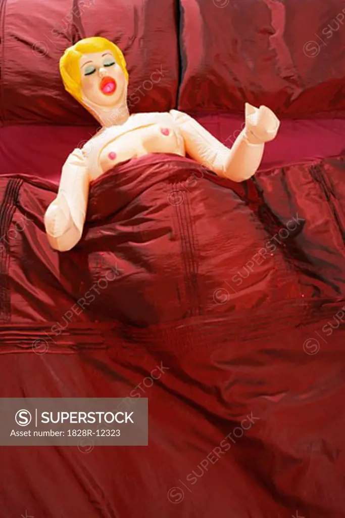 Blow-Up Doll in Bed   