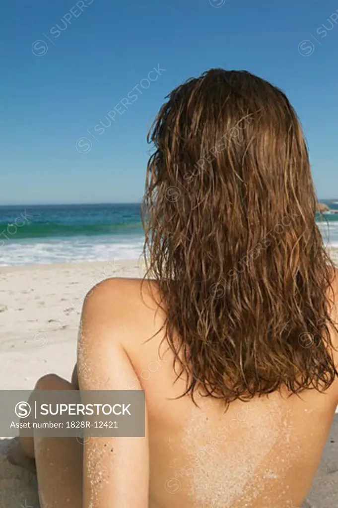 Woman Sitting on the Beach   
