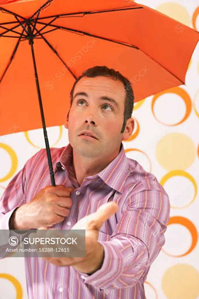 Man Holding Umbrella   
