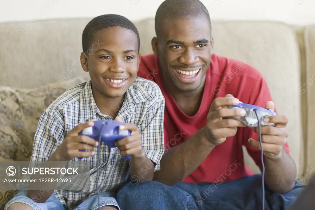 Brothers Playing Video Game   