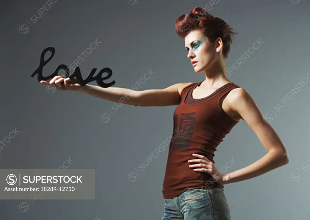 Woman Holding Love Sign   