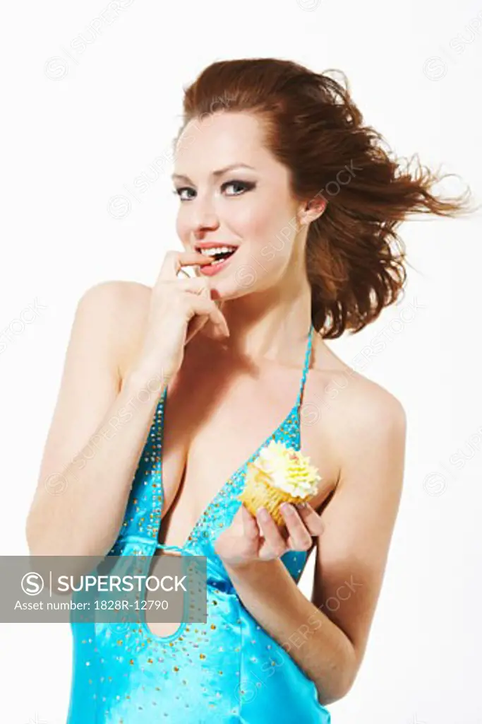 Portrait of Woman Eating Cupcake   