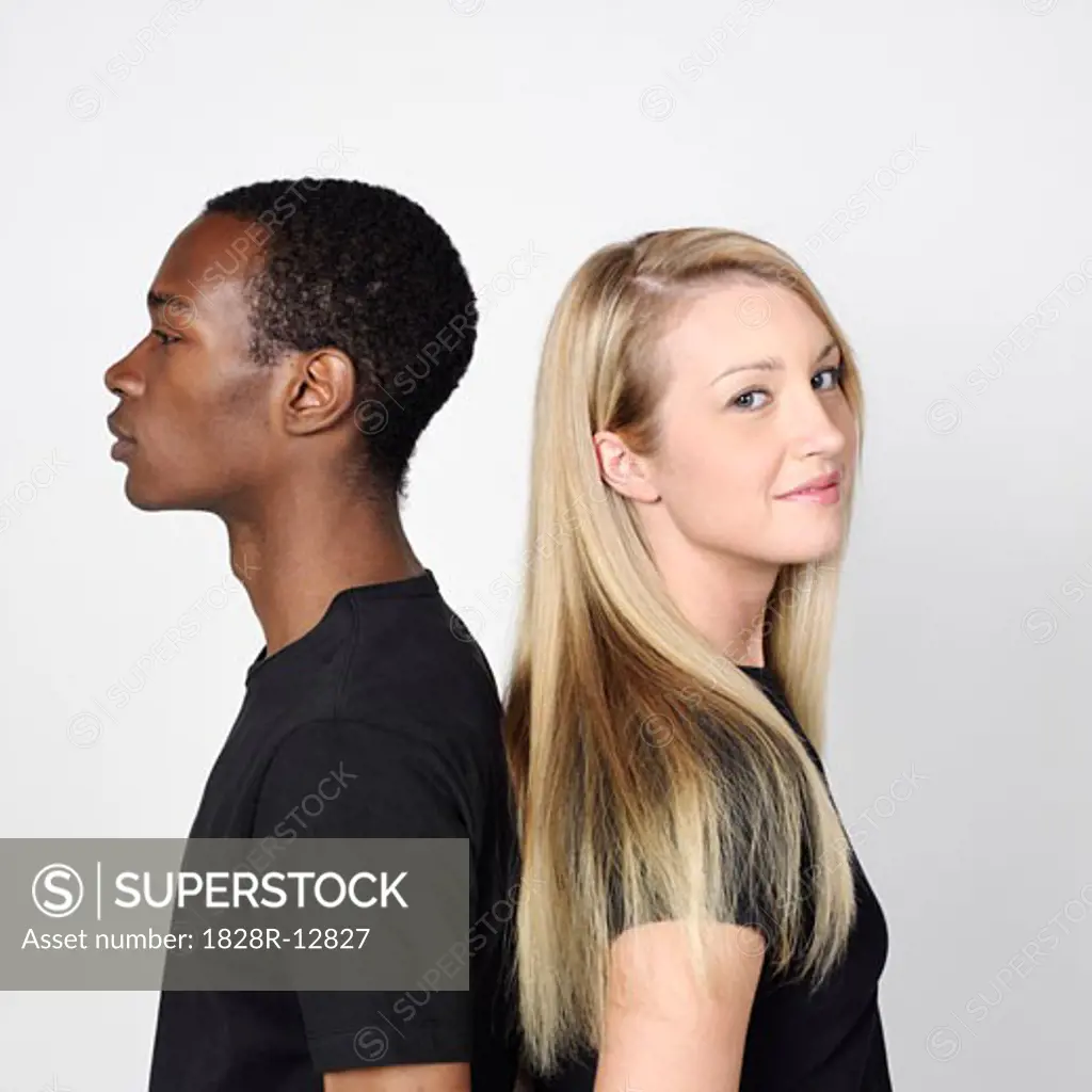 Couple Standing Back to Back   