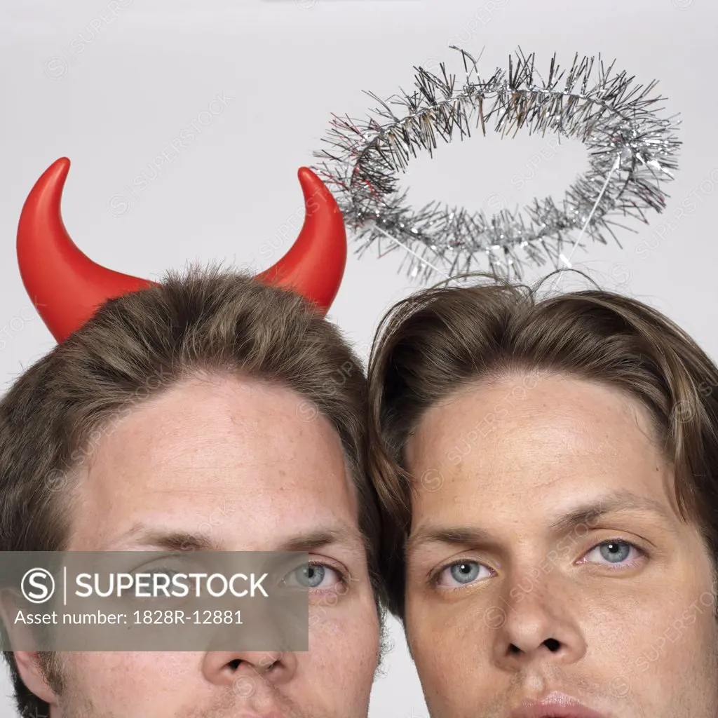 Portrait of Twin Brothers Dressed Like Devil and Angel   