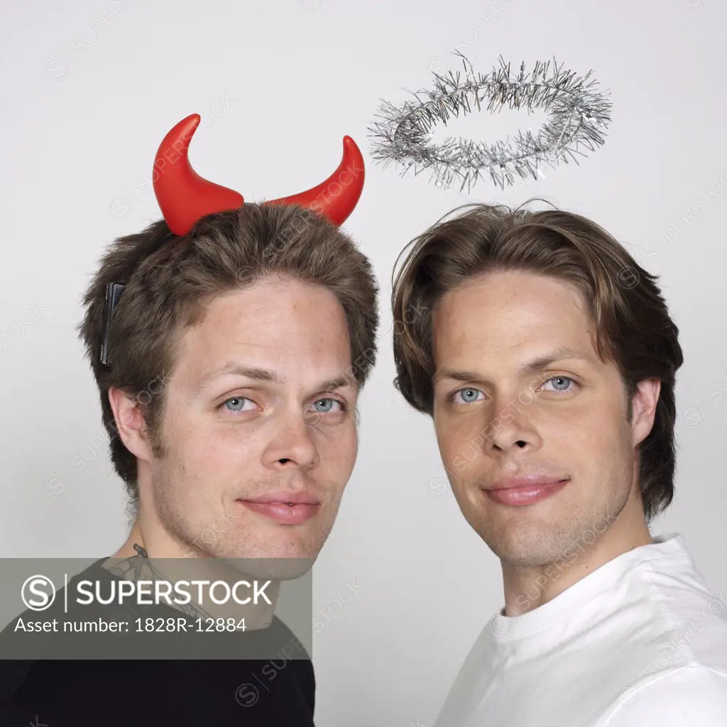 Portrait of Twin Brothers Dressed Like Devil and Angel   