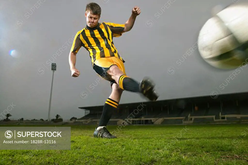 Player Kicking Soccer Ball   