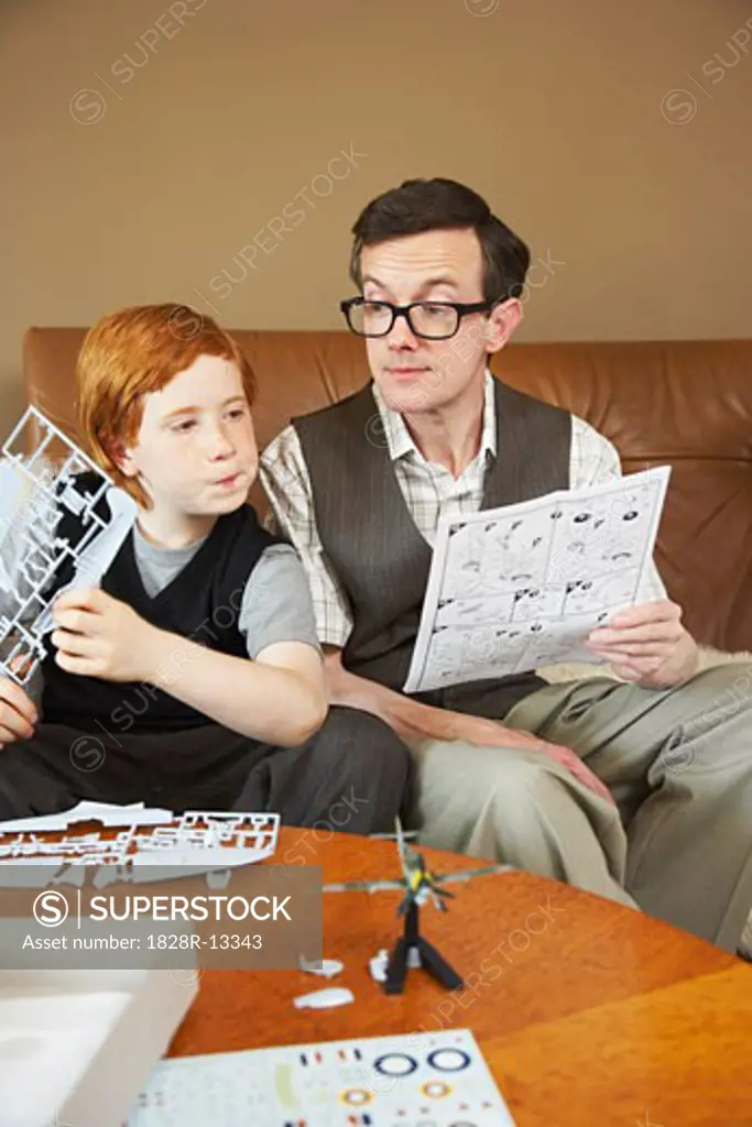Father and Son Doing Crafts Together   